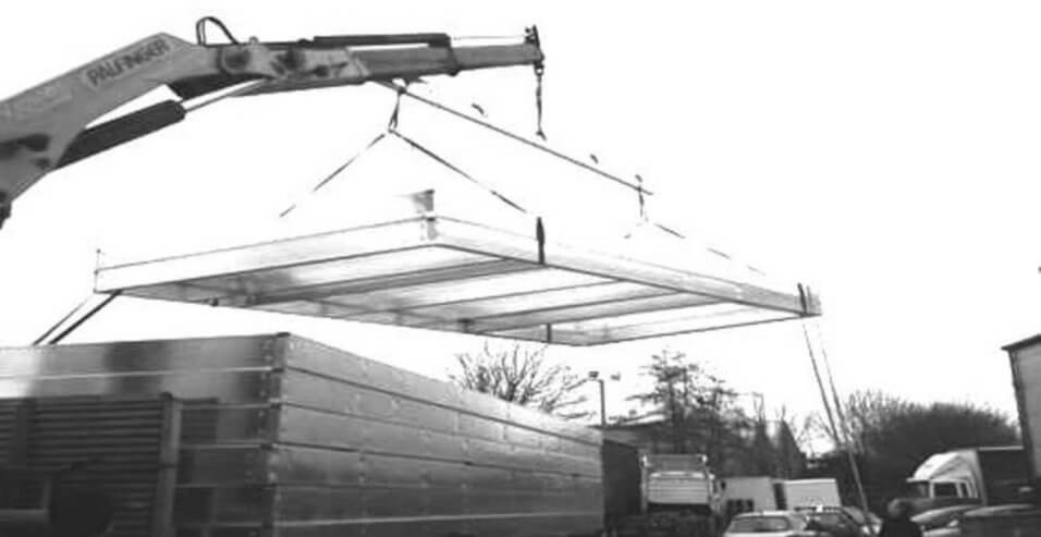 crane lifting large steel structure